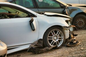 Heavy front end car accident damage on a vehicle involved in a collision